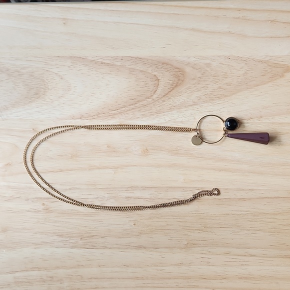 Necklace with a black charm and a purple cone-shaped rubber charm - Picture 1 of 4